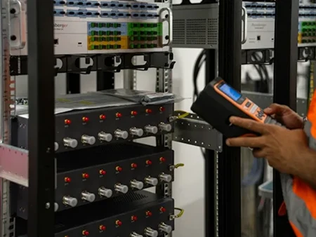 person inspecting network equipment